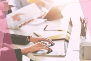 corporate woman typing on laptop