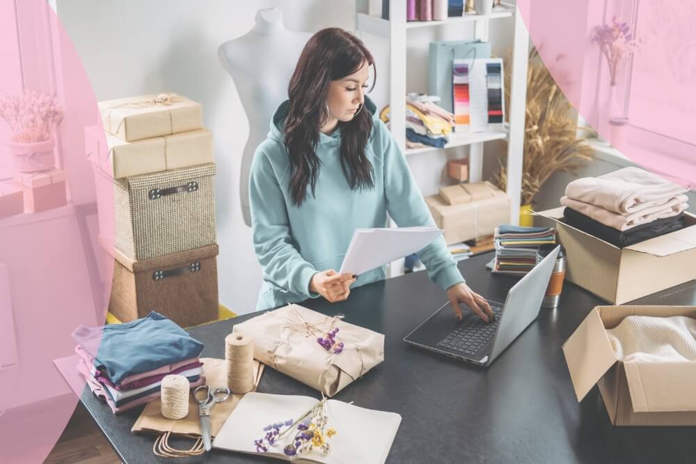 Female online store business owner packaging up orders