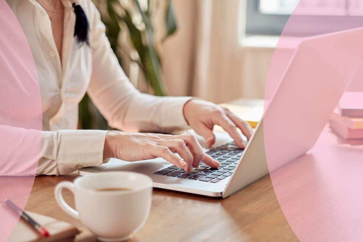 business owner at desk with laptop