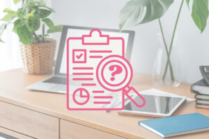 icon of an audit over a laptop on a desk