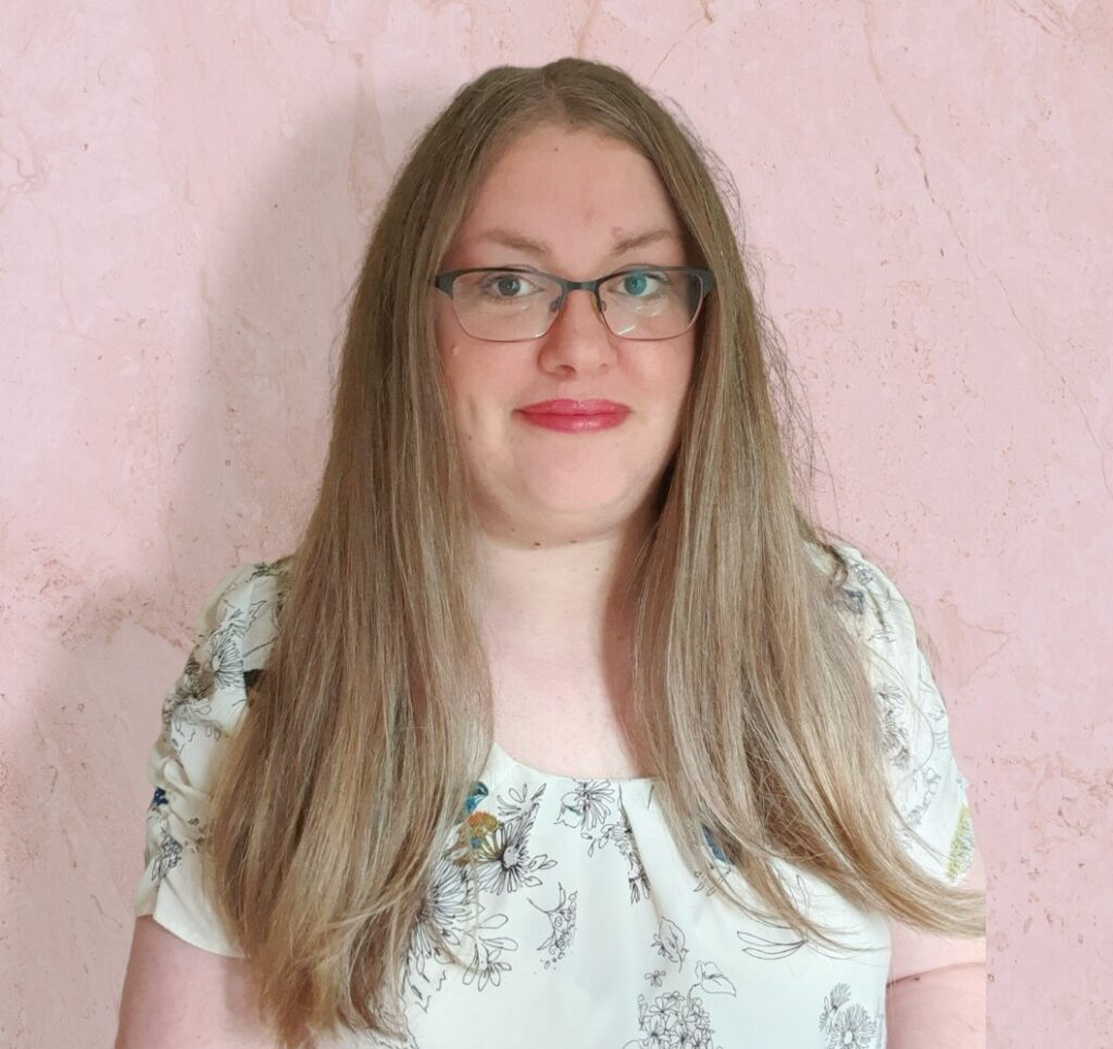 photo of Helen Garfield in a cream top with long hair