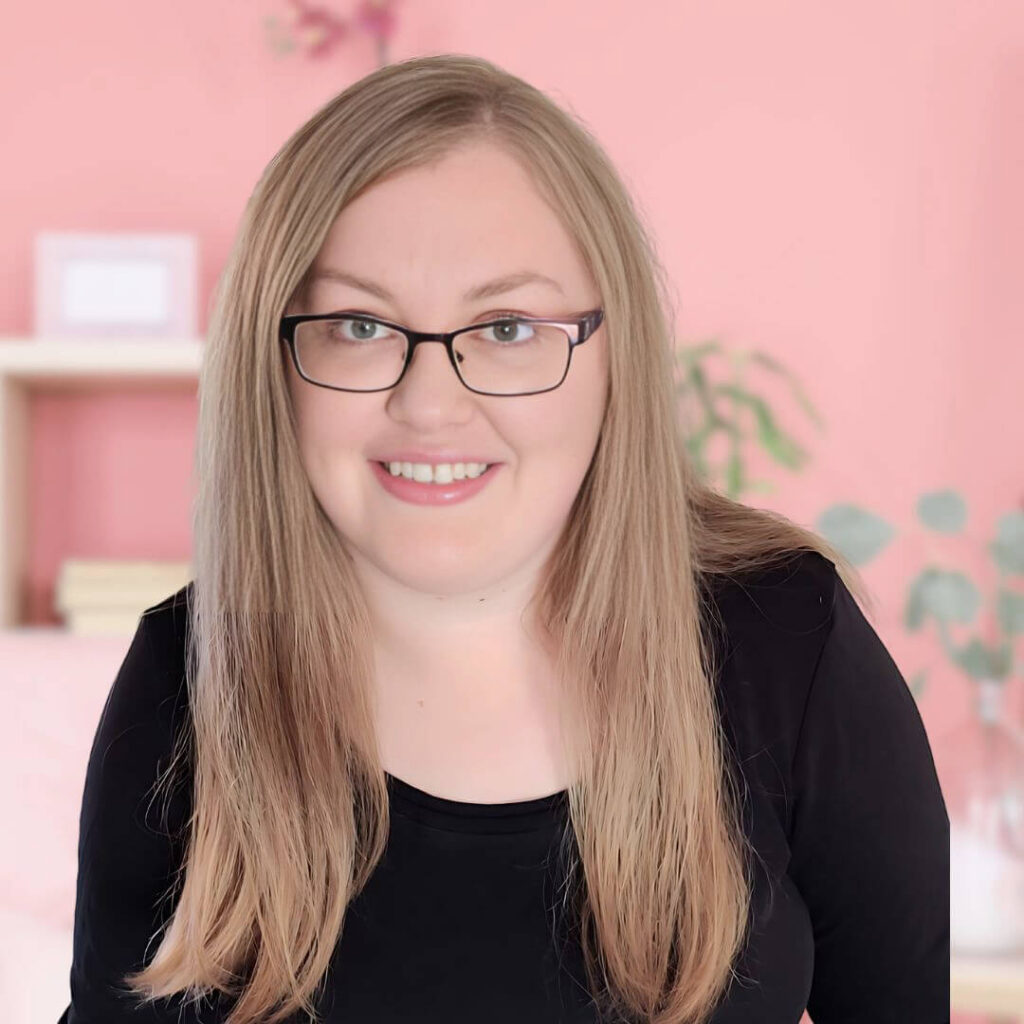 photo of Helen Garfield in dark jumper top and long hair