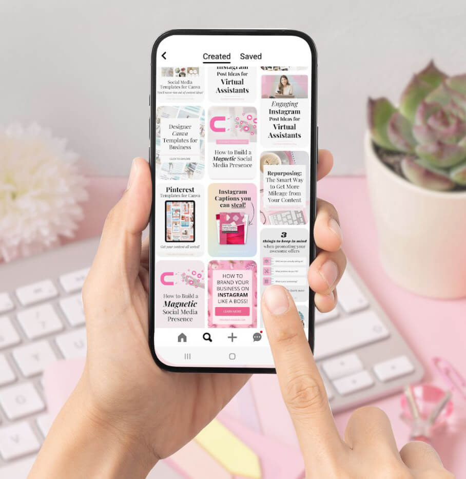 person holding a phone showing Pinterest feed